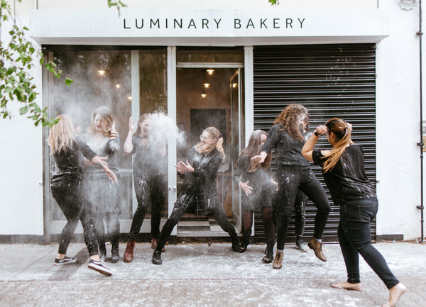 Luminary Team Throwing Flour Photo